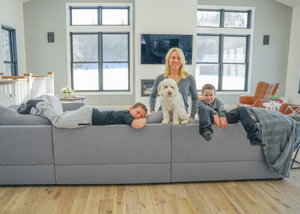 photo of a family together with their pet dog